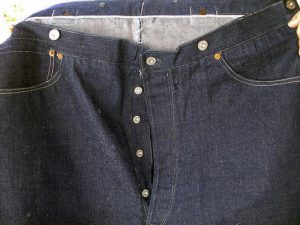 This undated photo provided by Daniel Buck Auctions & Appraisals shows the front of a pair of 1893 Levi-Strauss denim blue jeans in pristine condition that will go up for auction Saturday, Nov. 5, 2016 in Lisbon Falls, Maine. The auction house said the jeans were ordered for Solomon Warner, a businessman and pioneer who participated in the creation of the Arizona Territory. Warner wore them only a few times before falling ill. He died in 1899. (Daniel Buck Soules/Daniel Buck Auctions & Appraisals via AP)